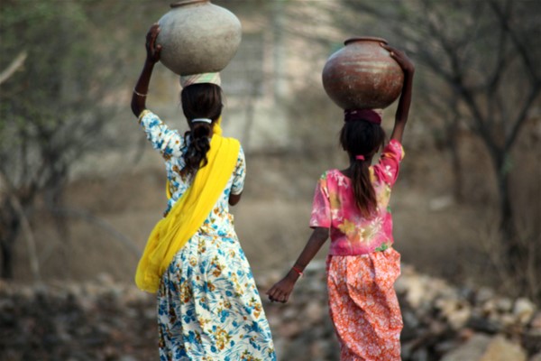 Children carrying water